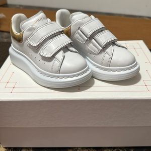 Lightly worn Alexander McQueen white and gold toddler sneakers.